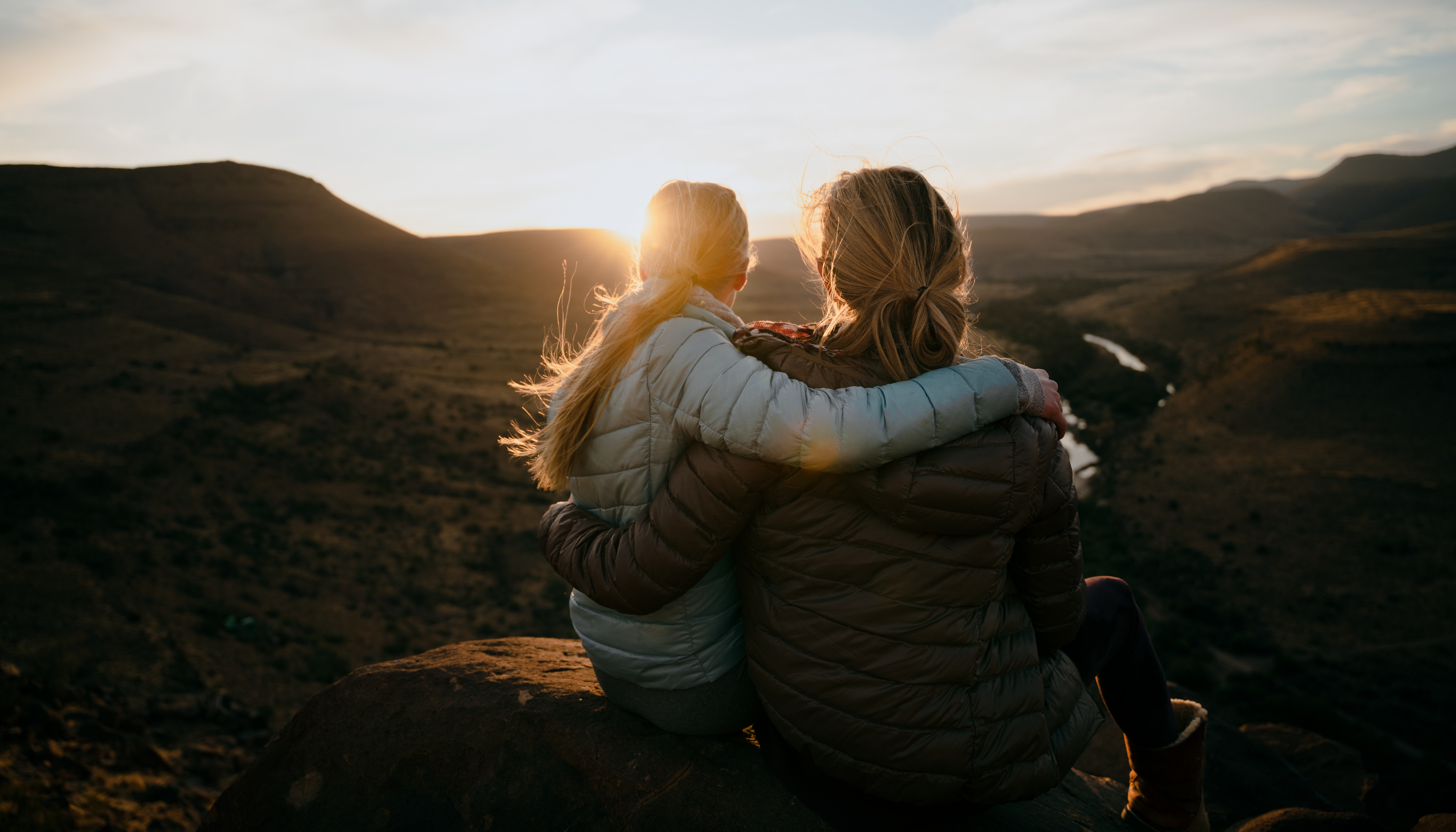 Two women enjoying a sunset view